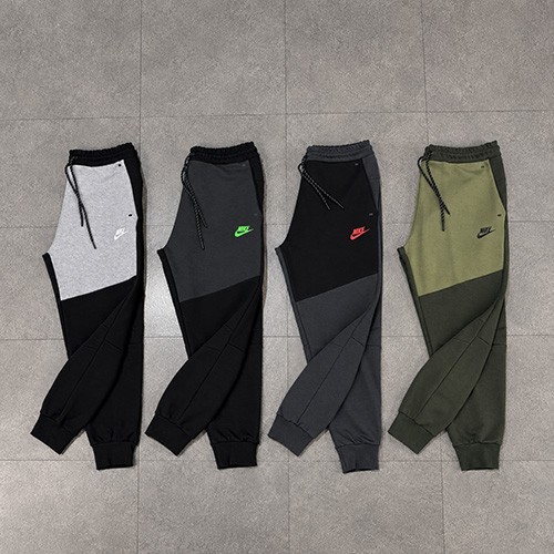 جاگر نایک تکفلیس (NIKE TECH FLEECE JOGGER 2025) رنگ مشکی نوک مدادی لوگو سبز سایز S